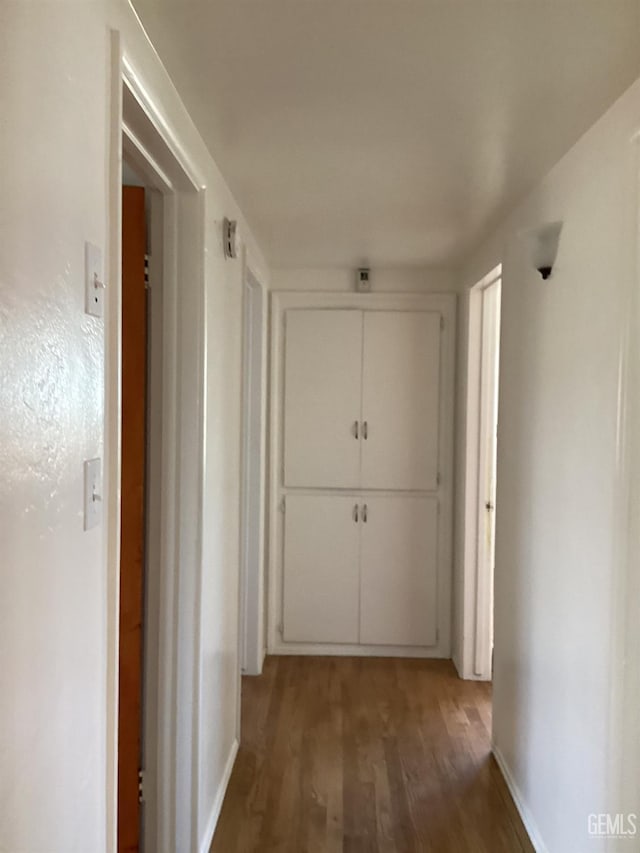 hallway featuring hardwood / wood-style floors