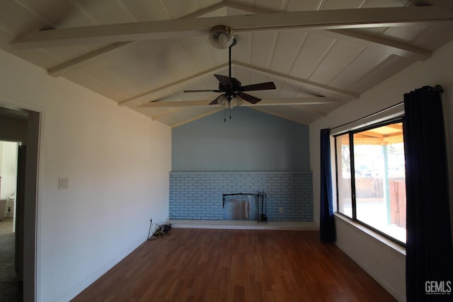 unfurnished living room with lofted ceiling with beams, a brick fireplace, ceiling fan, and wood finished floors