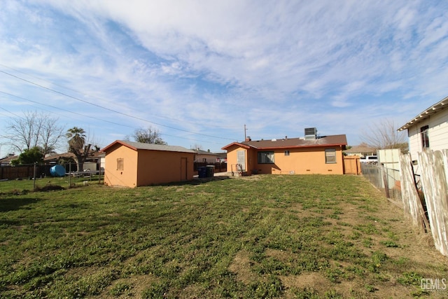 view of yard with fence and cooling unit