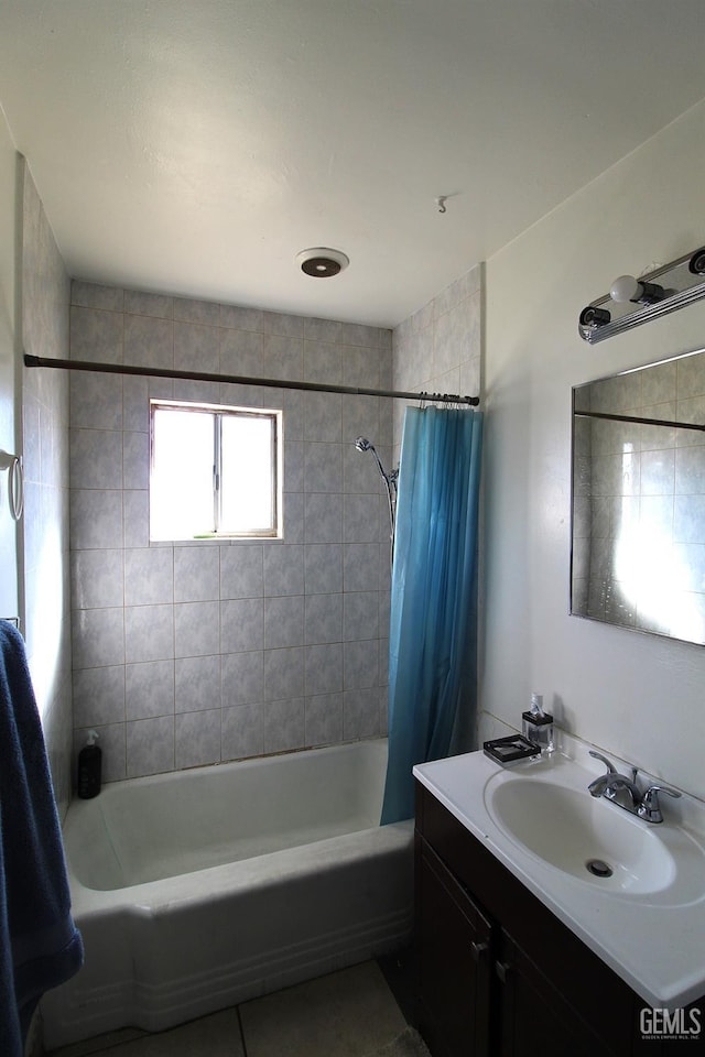 full bathroom featuring shower / bath combination with curtain and vanity