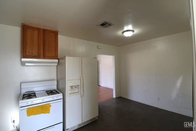 kitchen featuring light countertops, visible vents, brown cabinetry, white appliances, and under cabinet range hood