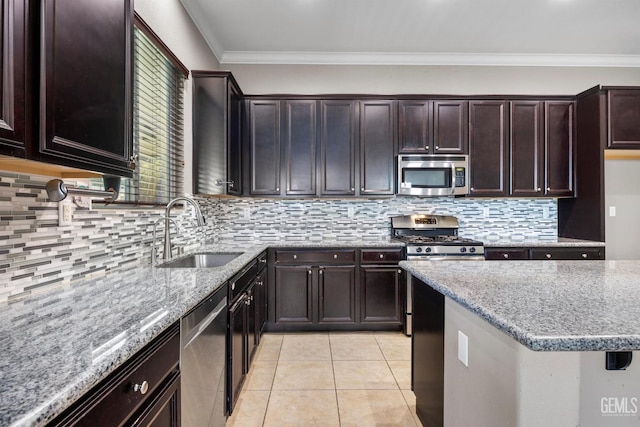 15420 Saint Clement Way, Bakersfield, CA 93314 - kitchen featuring stainless steel appliances, a sink, light stone counters, decorative backsplash, and crown molding