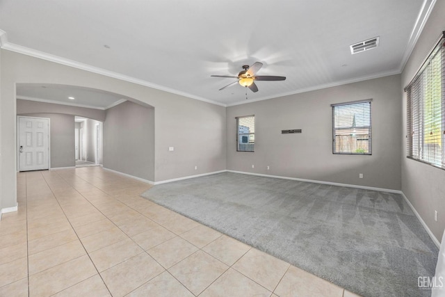 15420 Saint Clement Way, Bakersfield, CA 93314 - unfurnished room with ceiling fan, light tile patterned floors, baseboards, arched walkways, and ornamental molding