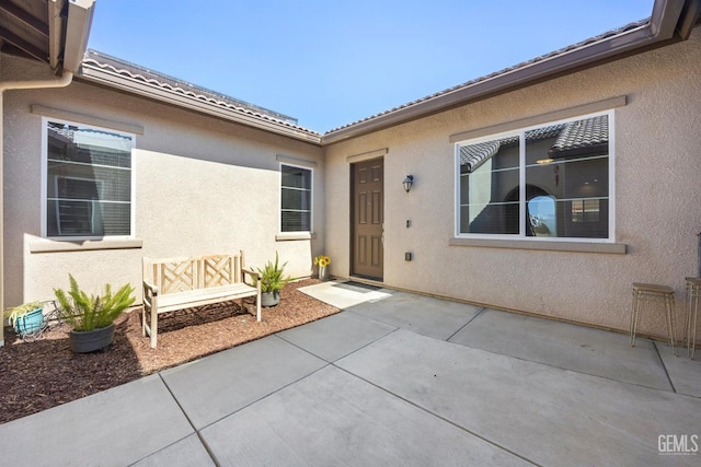 15420 Saint Clement Way, Bakersfield, CA 93314 - property entrance featuring a patio and stucco siding
