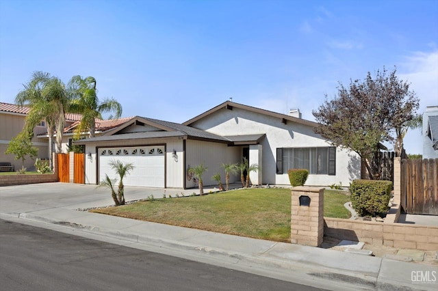 ranch-style home with a front yard and a garage