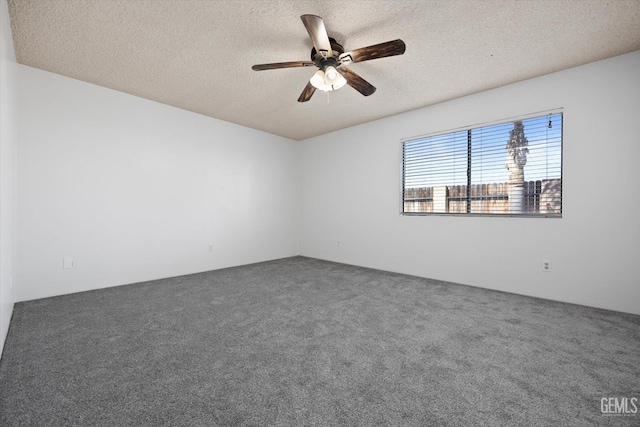 carpeted empty room with a textured ceiling and ceiling fan