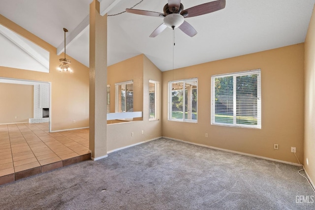 carpeted empty room with a ceiling fan, a brick fireplace, beamed ceiling, baseboards, and tile patterned floors