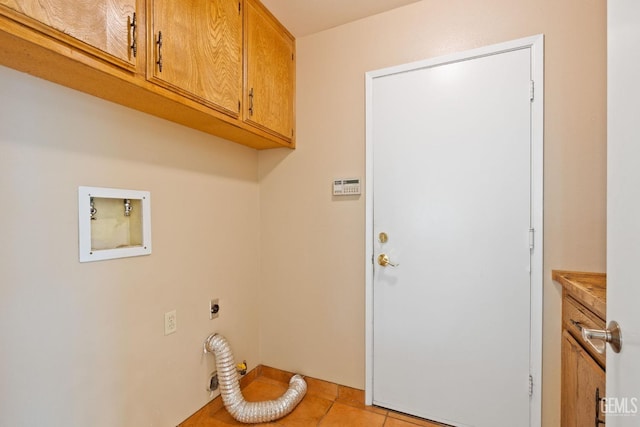 washroom featuring light tile patterned floors, cabinet space, hookup for a washing machine, and electric dryer hookup