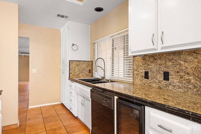 kitchen featuring beverage cooler, visible vents, white cabinets, dishwasher, and a sink