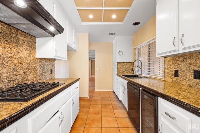 kitchen featuring beverage cooler, a sink, exhaust hood, white cabinets, and black appliances