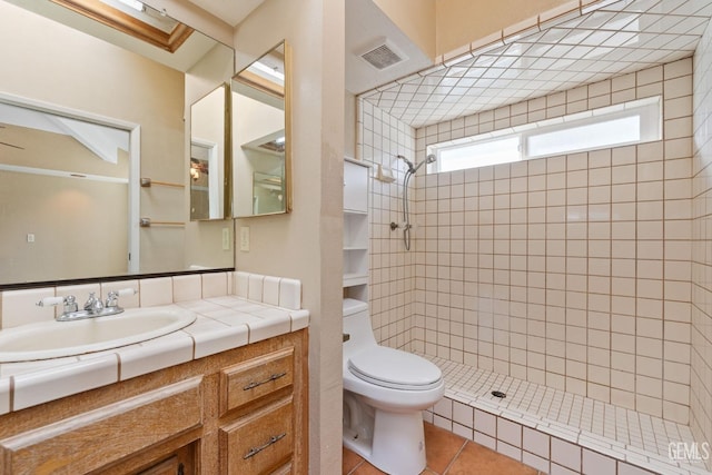 full bath featuring visible vents, toilet, tile patterned floors, vanity, and a shower stall