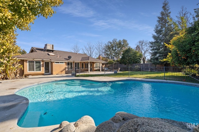 view of swimming pool with a fenced in pool, fence, and a patio