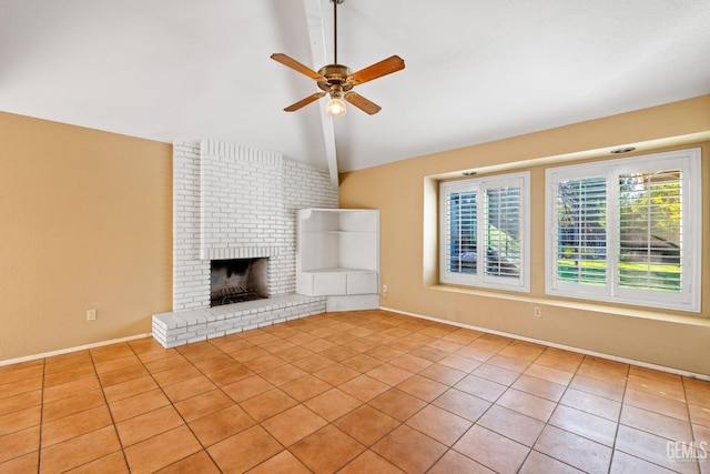 unfurnished living room with a fireplace, light tile patterned floors, lofted ceiling with beams, a ceiling fan, and baseboards