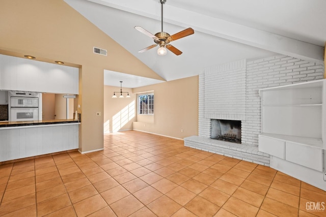 unfurnished living room with a fireplace, light tile patterned floors, visible vents, lofted ceiling with beams, and ceiling fan