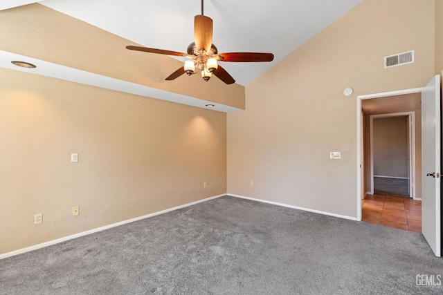 unfurnished room featuring ceiling fan, high vaulted ceiling, carpet floors, visible vents, and baseboards