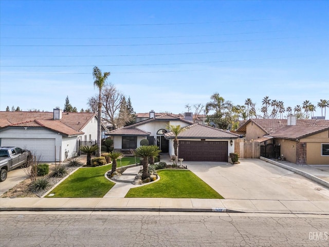 view of front of property with a garage and a front lawn