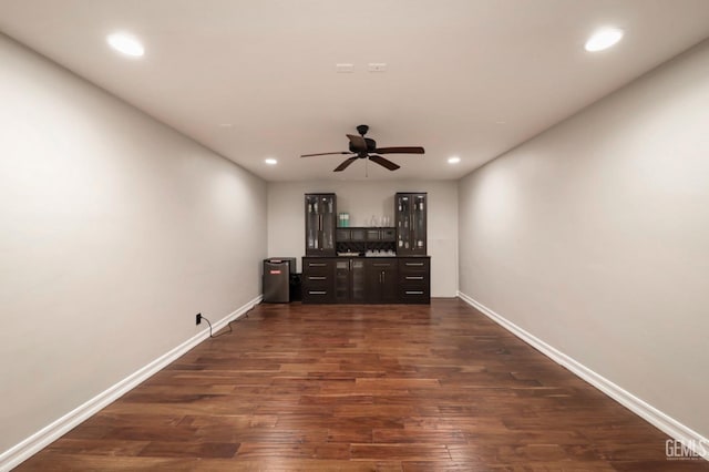 interior space featuring dark hardwood / wood-style flooring and ceiling fan