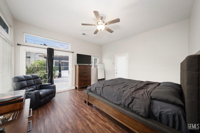 bedroom with dark hardwood / wood-style flooring, access to exterior, and ceiling fan