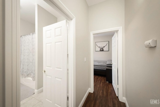 hall with hardwood / wood-style flooring