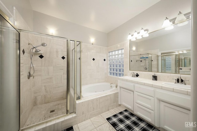 bathroom featuring vanity, shower with separate bathtub, and tile patterned flooring