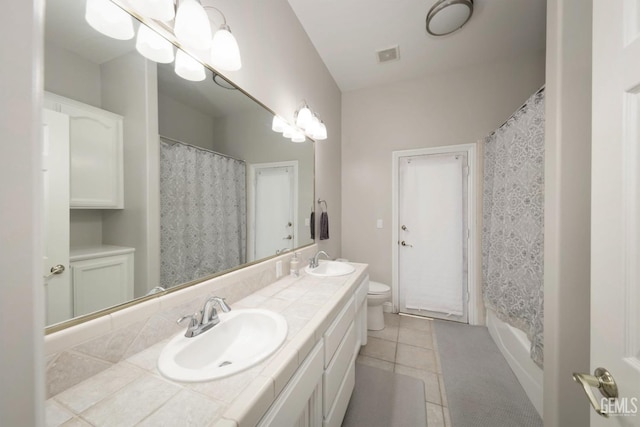 bathroom with walk in shower, vanity, toilet, and tile patterned flooring