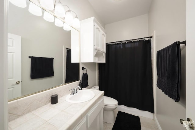 bathroom featuring vanity, a shower with curtain, tile patterned floors, and toilet