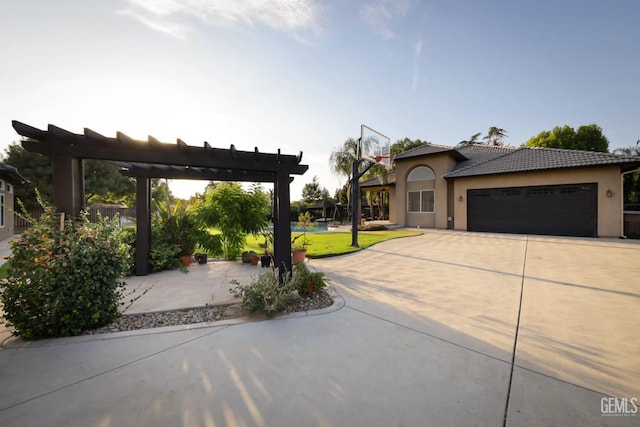 exterior space with a pergola and a garage