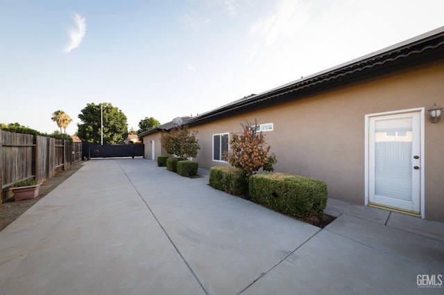 view of property exterior featuring a patio