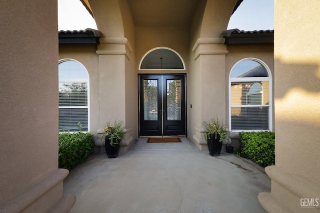 entrance to property featuring french doors