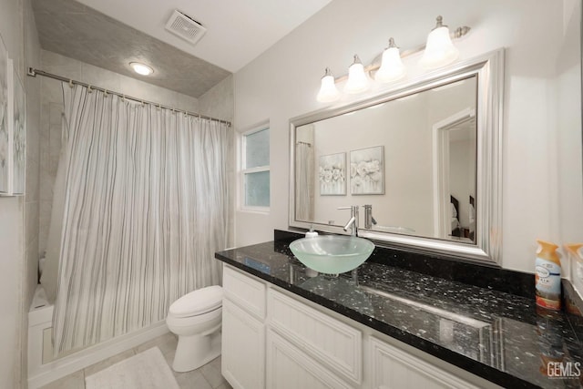 full bathroom with tile patterned floors, vanity, toilet, and shower / tub combo