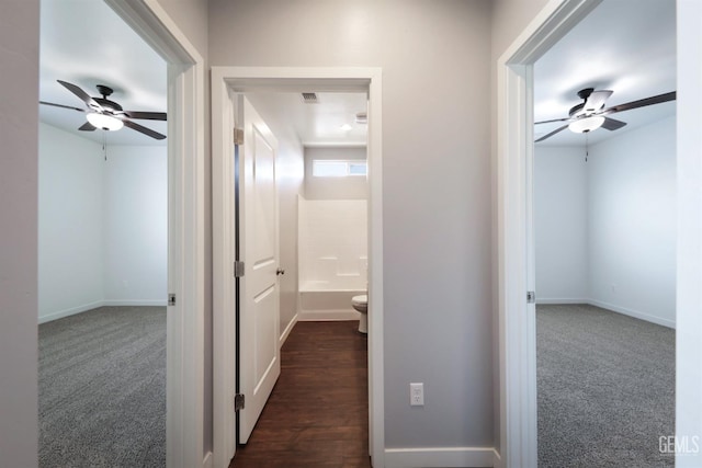 5817 Neutra Dr, Bakersfield, CA 93311 - corridor featuring dark colored carpet and baseboards
