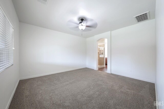 5817 Neutra Dr, Bakersfield, CA 93311 - carpeted spare room featuring arched walkways and ceiling fan