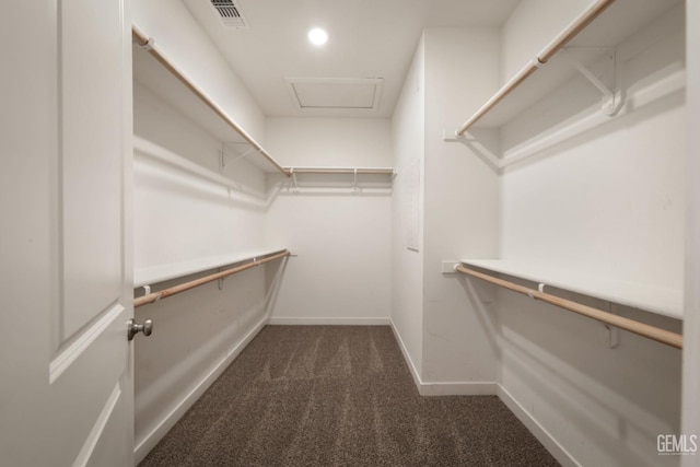 5817 Neutra Dr, Bakersfield, CA 93311 - spacious closet featuring dark colored carpet and attic access