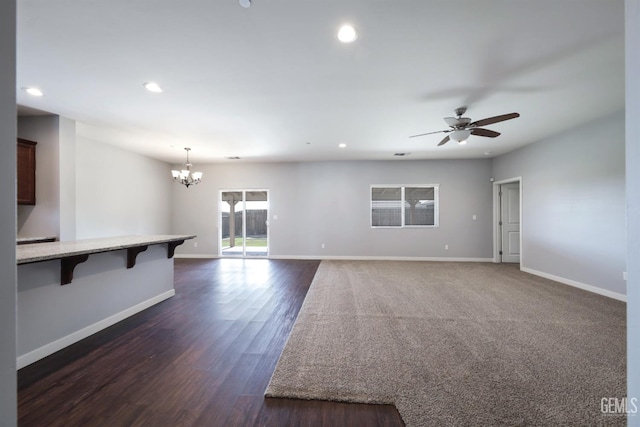 5817 Neutra Dr, Bakersfield, CA 93311 - unfurnished living room with ceiling fan, recessed lighting, a chandelier, and dark wood-style flooring