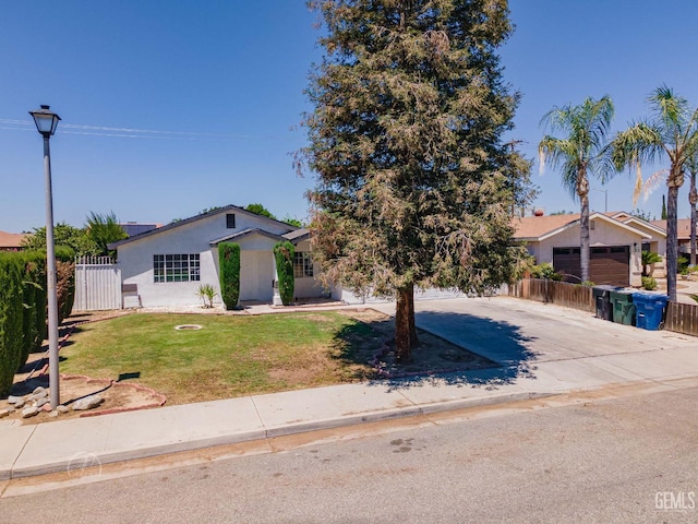 1857 Fern Tree Close, Wasco, CA 93280 - view of front of house featuring stucco siding, driveway, and an attached garage