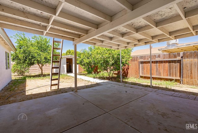 1857 Fern Tree Close, Wasco, CA 93280 - fenced backyard featuring a storage shed and a patio area