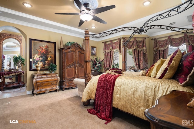 bedroom featuring a ceiling fan, crown molding, and light colored carpet