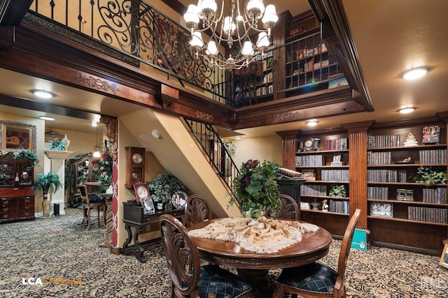 carpeted dining room featuring a chandelier and stairway