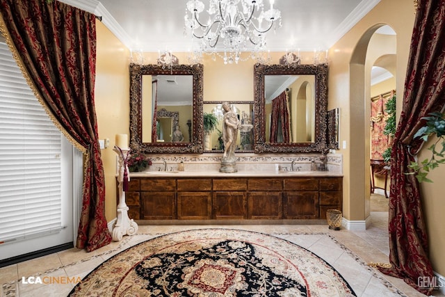 full bath with double vanity, tile patterned flooring, ornamental molding, and a sink