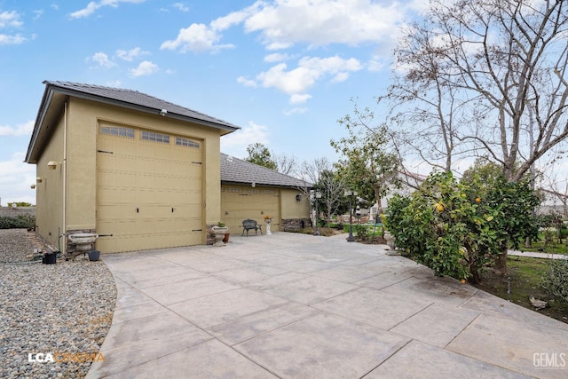 view of side of property featuring stucco siding