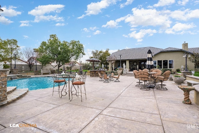 view of swimming pool with a fenced in pool, a patio, and fence