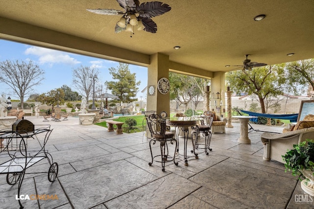 view of patio / terrace featuring outdoor dining space and ceiling fan