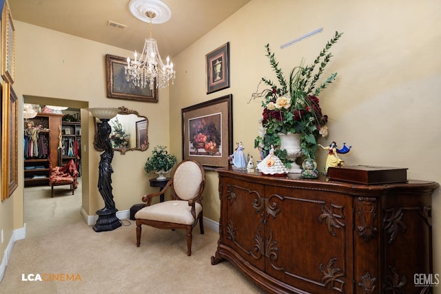 living area featuring light carpet, baseboards, visible vents, and an inviting chandelier