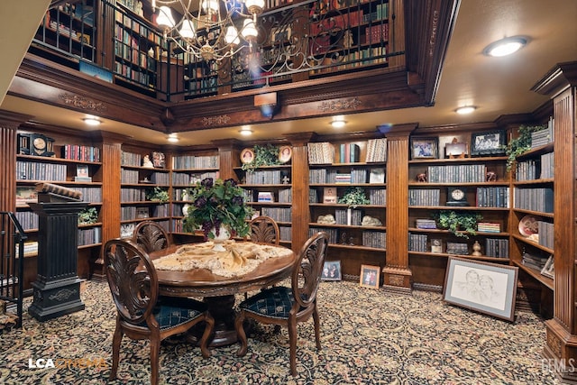 dining room featuring ornamental molding and a chandelier