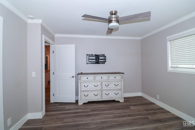 unfurnished bedroom featuring dark hardwood / wood-style flooring, ceiling fan, and ornamental molding