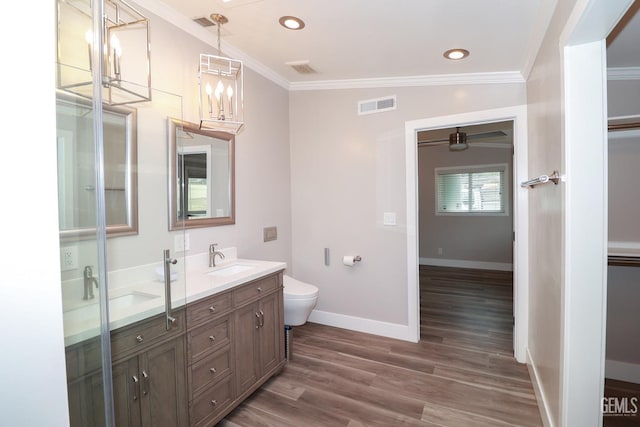 bathroom with hardwood / wood-style flooring, vanity, lofted ceiling, and ornamental molding