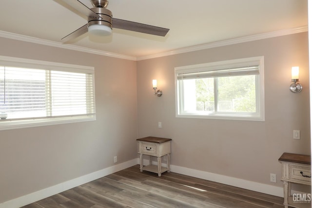 spare room with ceiling fan, dark wood-type flooring, and ornamental molding