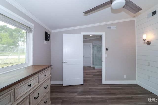 unfurnished bedroom featuring multiple windows, ceiling fan, dark hardwood / wood-style floors, and vaulted ceiling