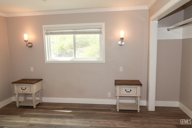 unfurnished room with dark hardwood / wood-style flooring and ornamental molding