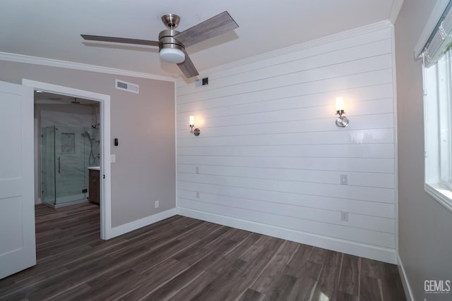 empty room featuring dark hardwood / wood-style floors, ceiling fan, lofted ceiling, and crown molding